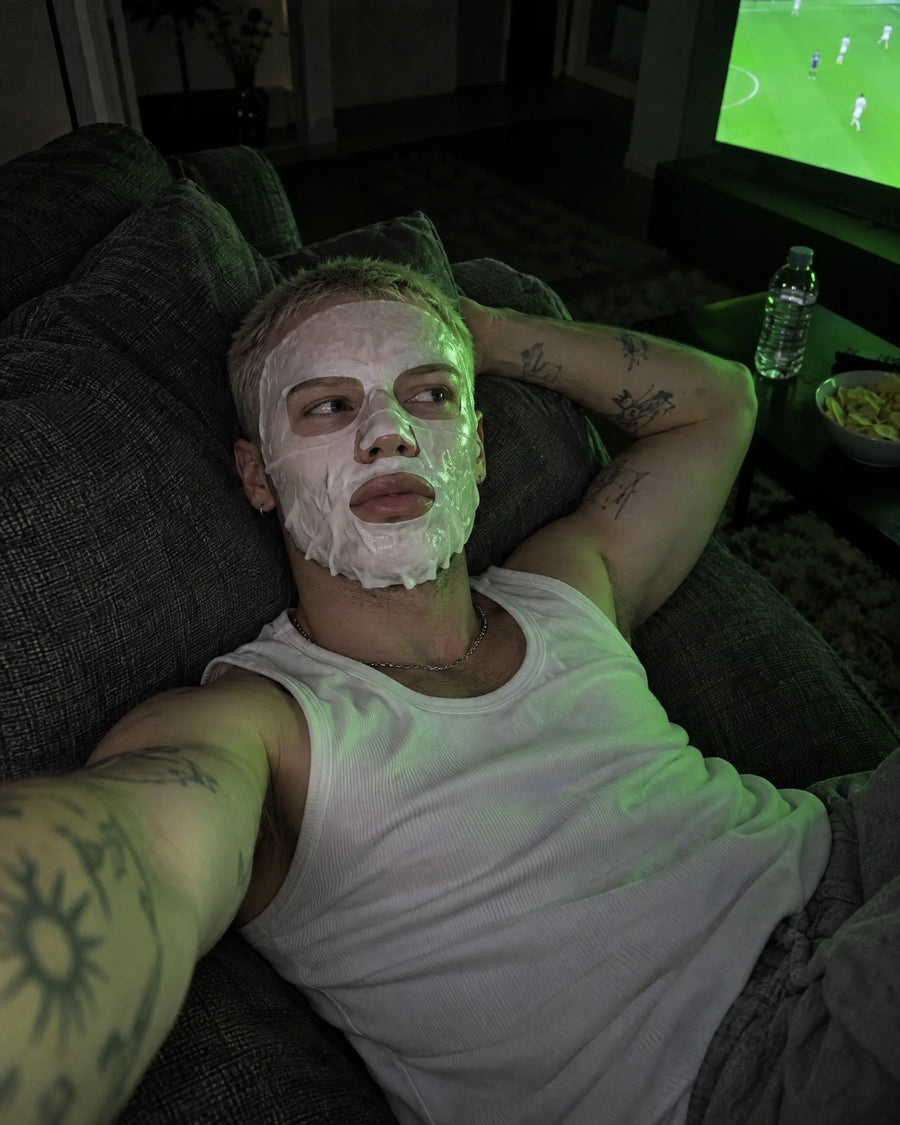 The sofa — football is on